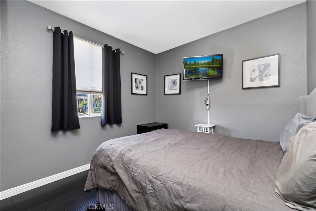 7029 Penny Court Rancho Cucamonga, CA 91739 - Photo 9 of 42 a bedroom with a bed and a wall painting