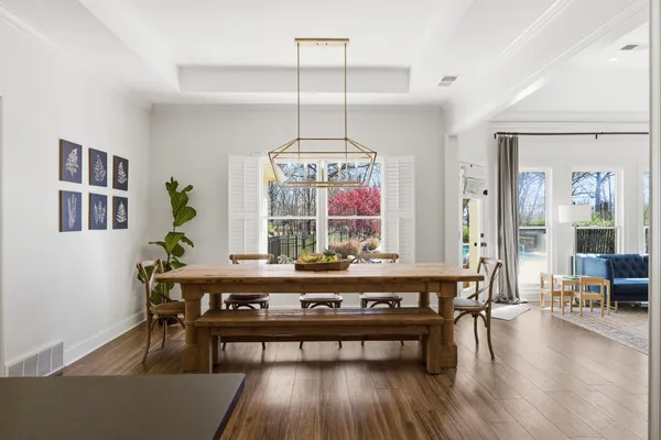 a view of a dining room with furniture window and wooden floor