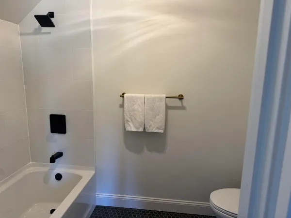 a bathroom with a bathtub and sink