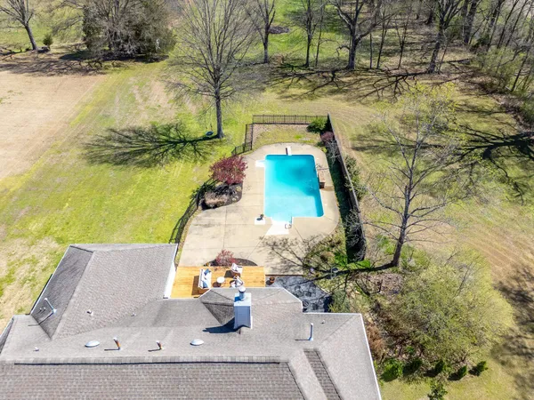 a view of swimming pool with a yard