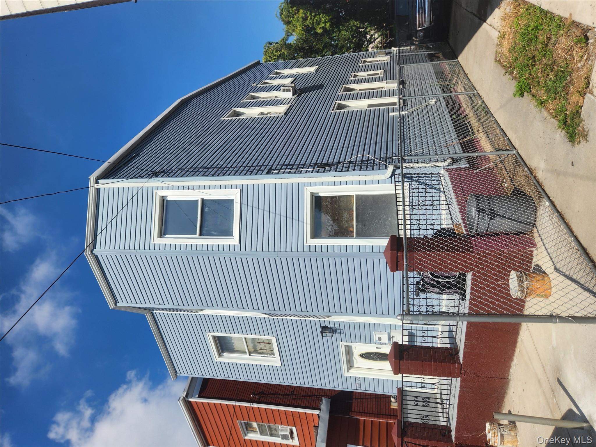 108-27 50th Avenue Queens, NY 11368 - Photo 2 of 2 a brick house with a large windows