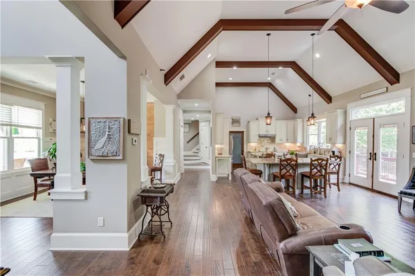 a kitchen with granite countertop a sink stove and cabinets