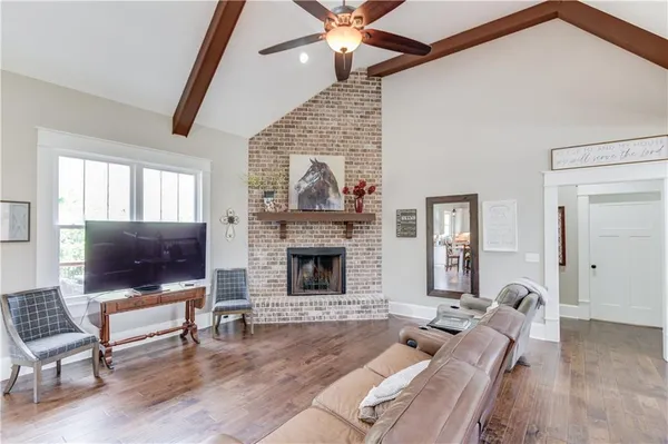 a kitchen with stainless steel appliances granite countertop a sink a stove a refrigerator and cabinets