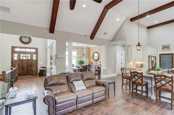 a room with furniture and wooden floor