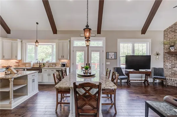 a bedroom with a bed dresser and a window
