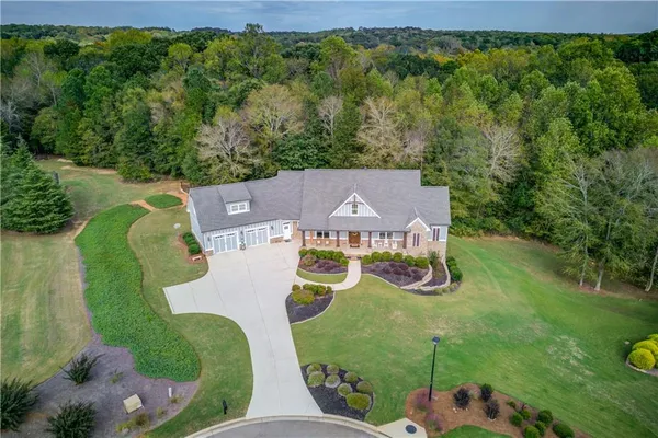 a front view of a house with outdoor seating