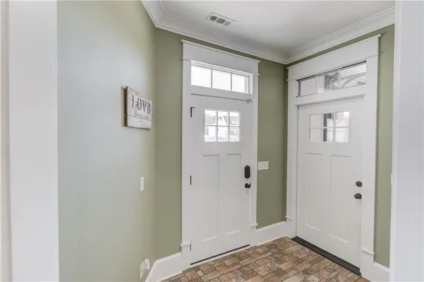 an empty room with closet and wooden floor