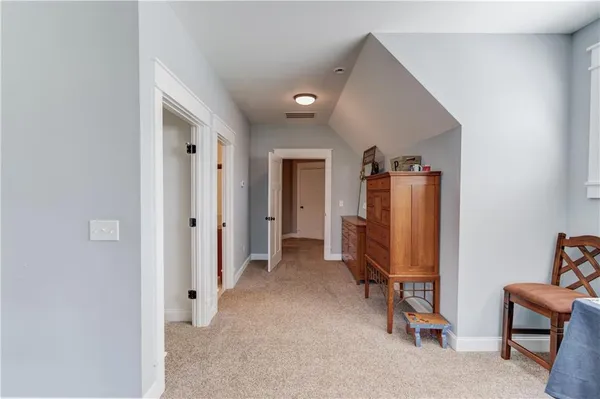 a view of a balcony with chair and wooden floor