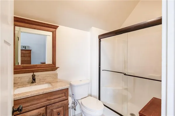 a view of a roof deck with wooden floor and fence