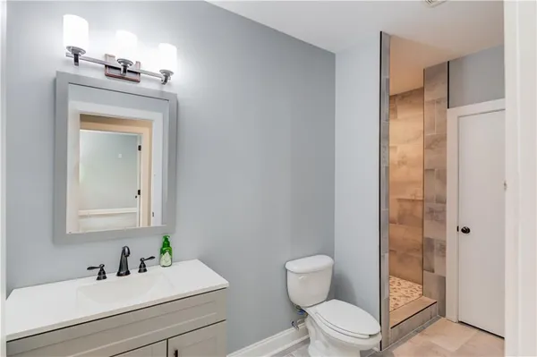 an aerial view of a house with a garden and outdoor seating