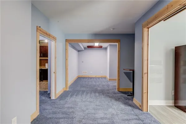 a view of a swimming pool and trees in the background