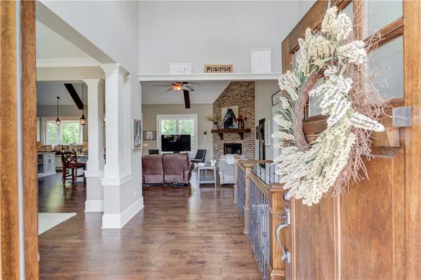 a living room with furniture wooden floor and a fireplace