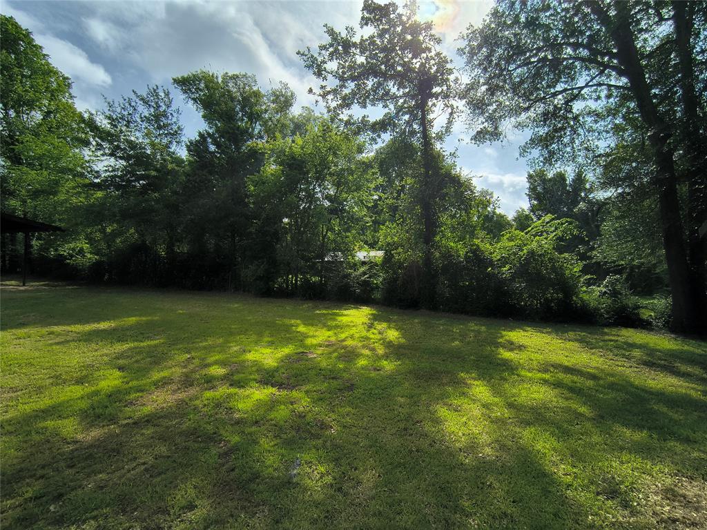 180 Arrowhead Street Mabank, TX 75156 - Photo 12 of 26 a view of a green yard