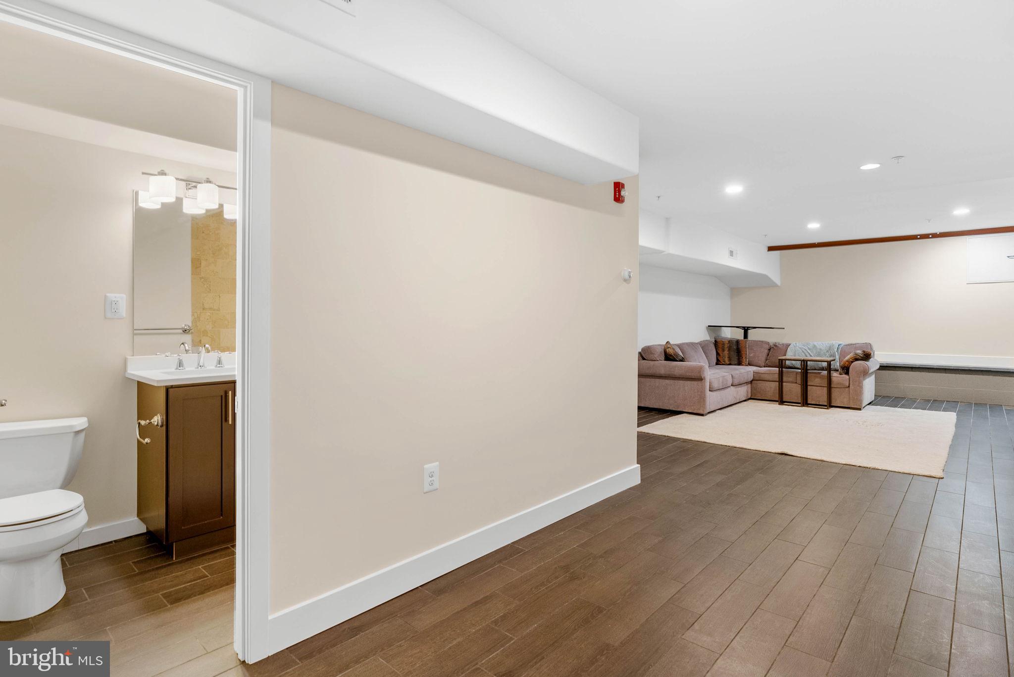 924 South 11th Street, Unit 101 Philadelphia, PA 19147 - Photo 19 of 27 a view of a bathroom with a sink and a toilet
