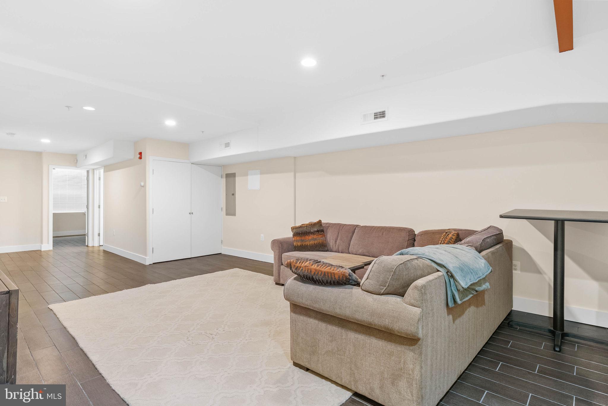 924 South 11th Street, Unit 101 Philadelphia, PA 19147 - Photo 22 of 27 a living room with furniture and a couch