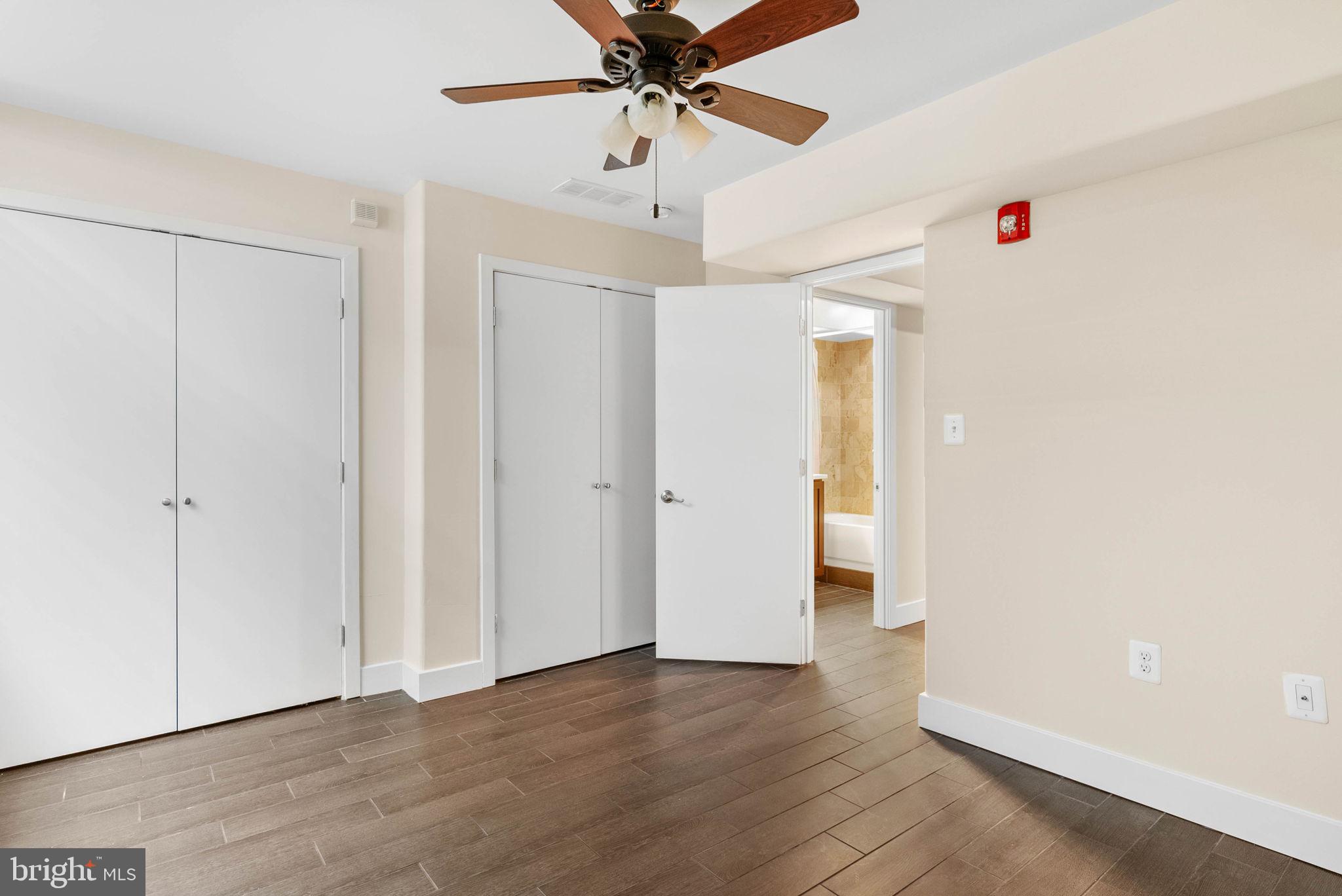924 South 11th Street, Unit 101 Philadelphia, PA 19147 - Photo 25 of 27 a view of a livingroom with a ceiling fan and wooden floor