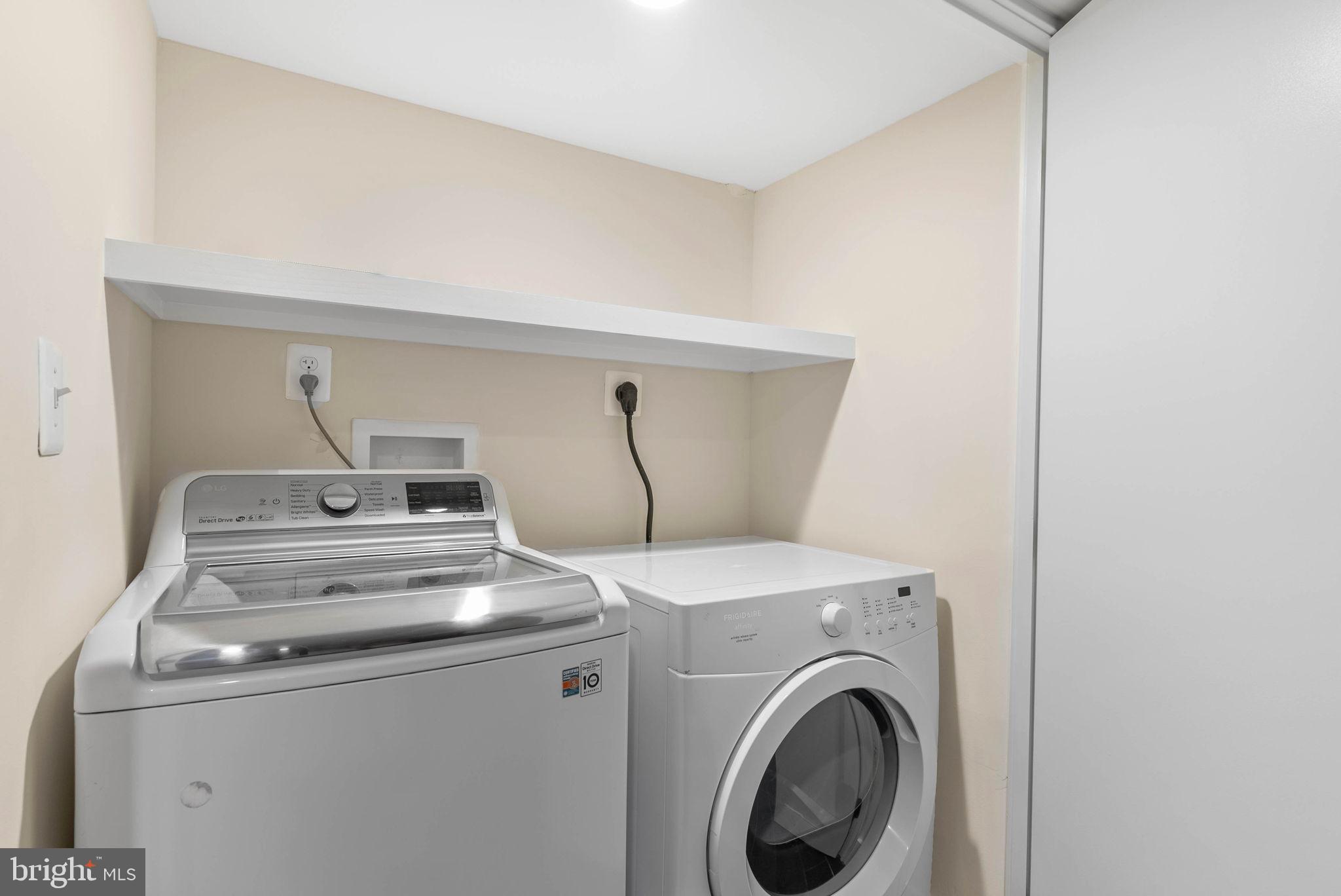 924 South 11th Street, Unit 101 Philadelphia, PA 19147 - Photo 26 of 27 a utility room with dryer and washer