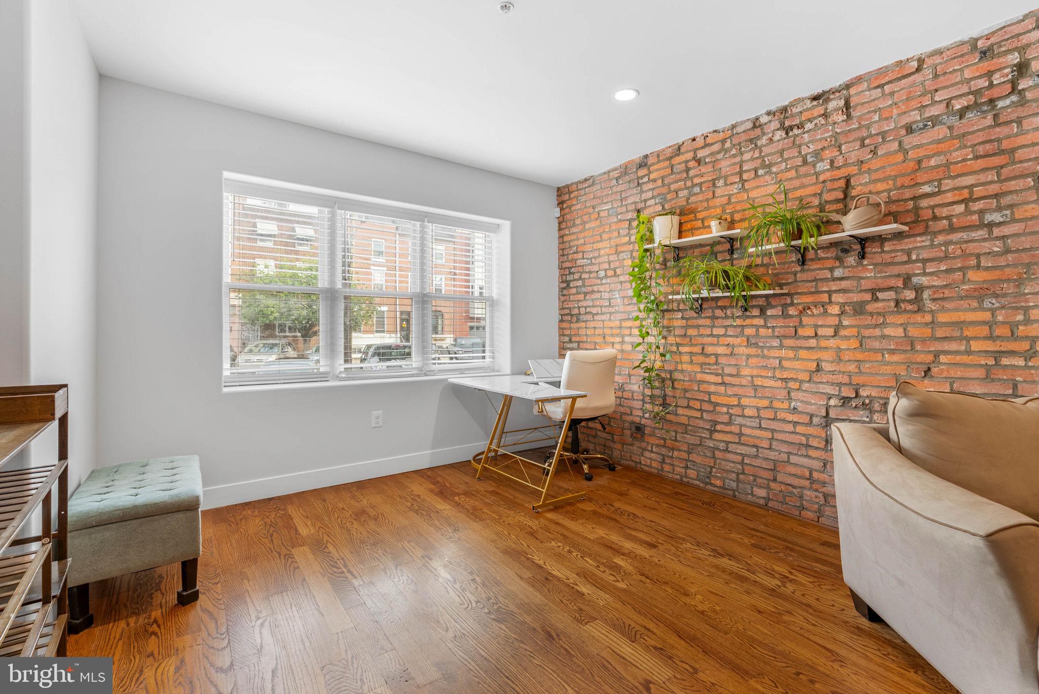924 South 11th Street, Unit 101 Philadelphia, PA 19147 - Photo 7 of 27 a view of workspace with wooden floor
