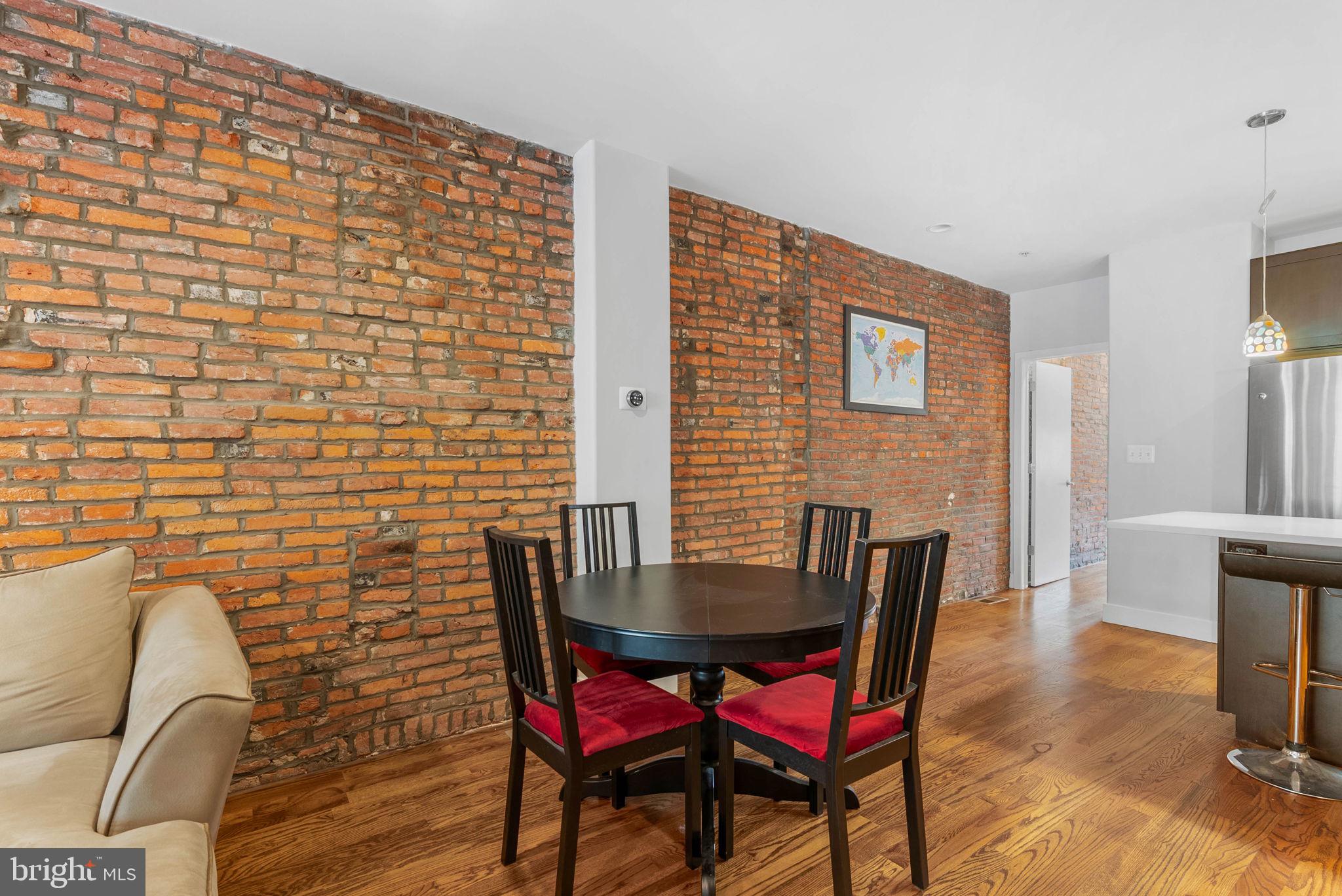 924 South 11th Street, Unit 101 Philadelphia, PA 19147 - Photo 8 of 27 a view of a dining room with furniture