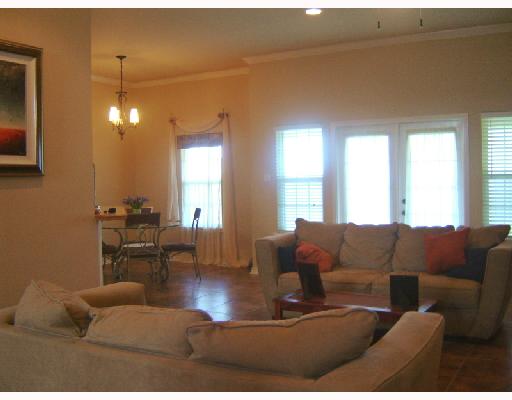 13982 Windjammer Drive Corpus Christi, TX 78418 - Photo 5 of 7 a living room with furniture and a large window