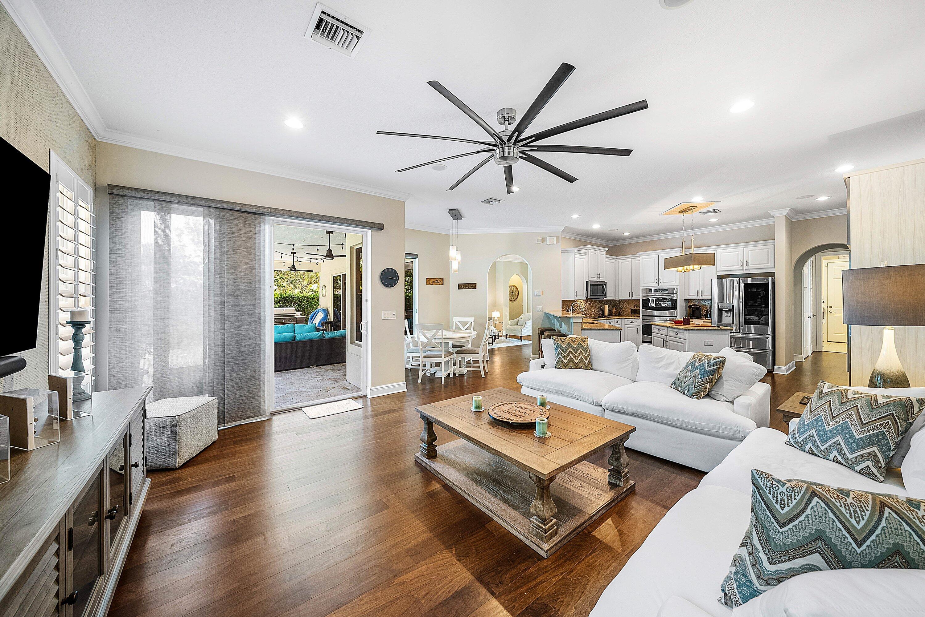 287 Rudder Cay Way Jupiter, FL 33458 - Photo 17 of 88 a living room with furniture a rug and a flat screen tv
