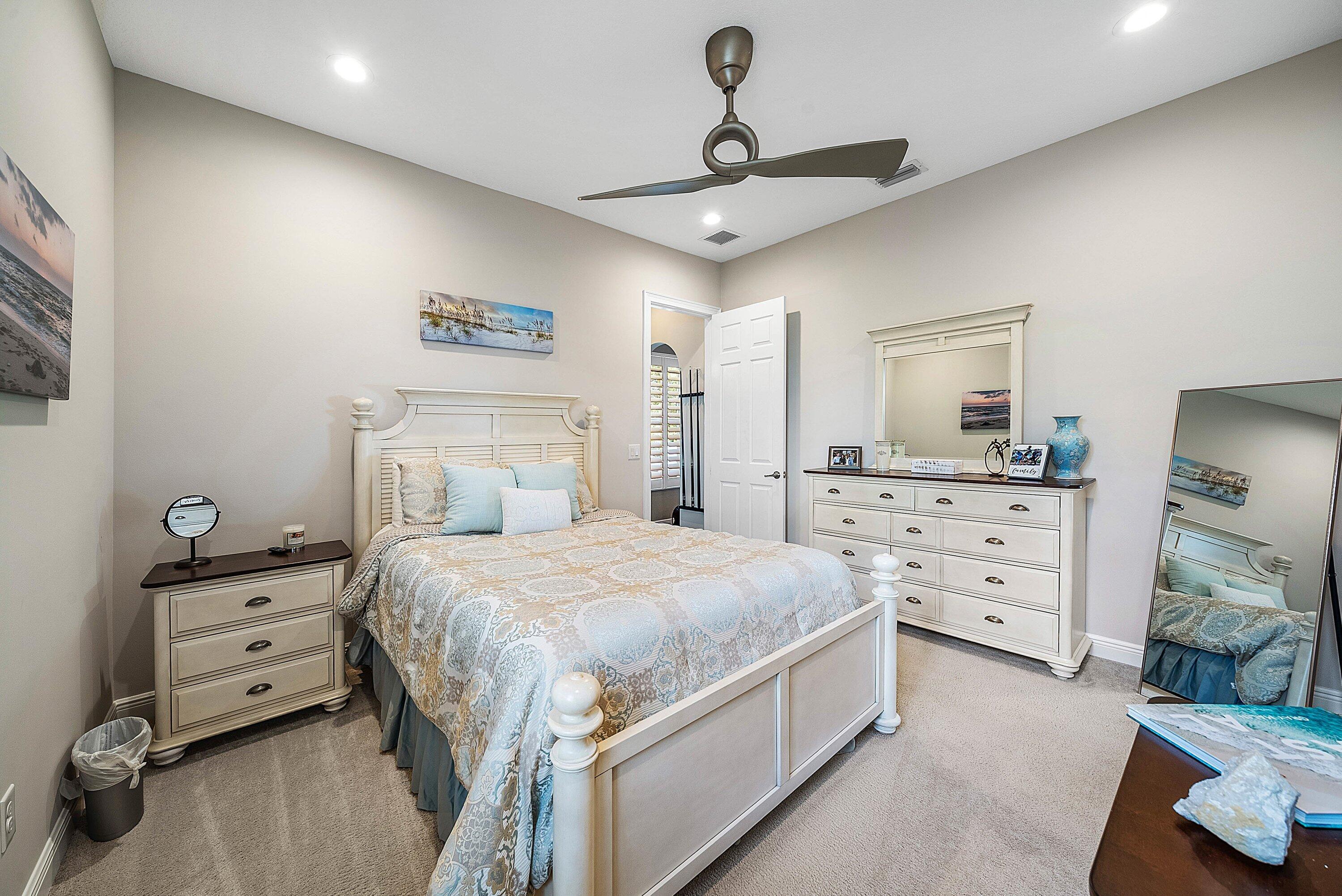 287 Rudder Cay Way Jupiter, FL 33458 - Photo 26 of 88 a bedroom with a bed and a dresser
