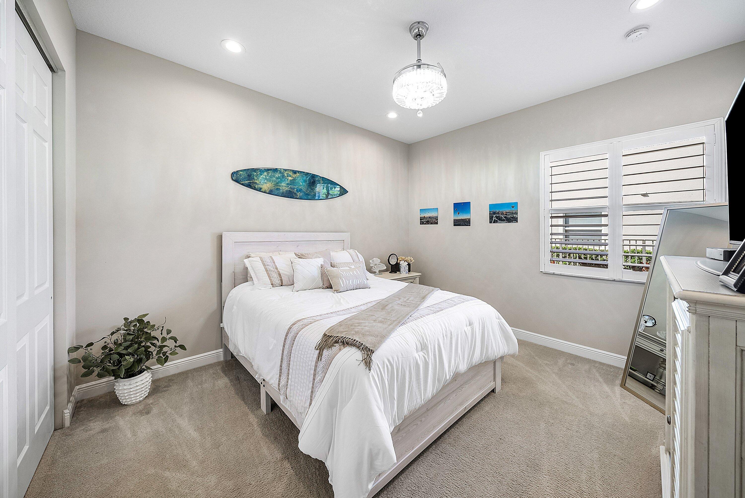 287 Rudder Cay Way Jupiter, FL 33458 - Photo 27 of 88 a bedroom with a bed and a window