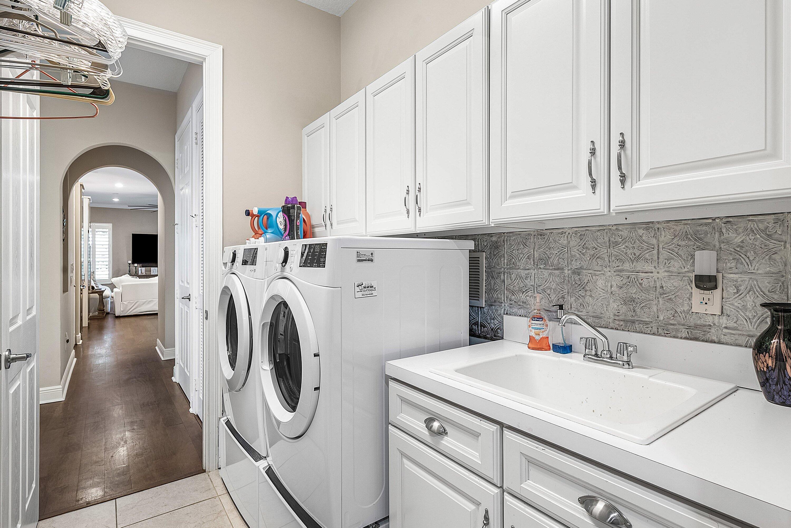 287 Rudder Cay Way Jupiter, FL 33458 - Photo 32 of 88 a utility room with dryer and washer