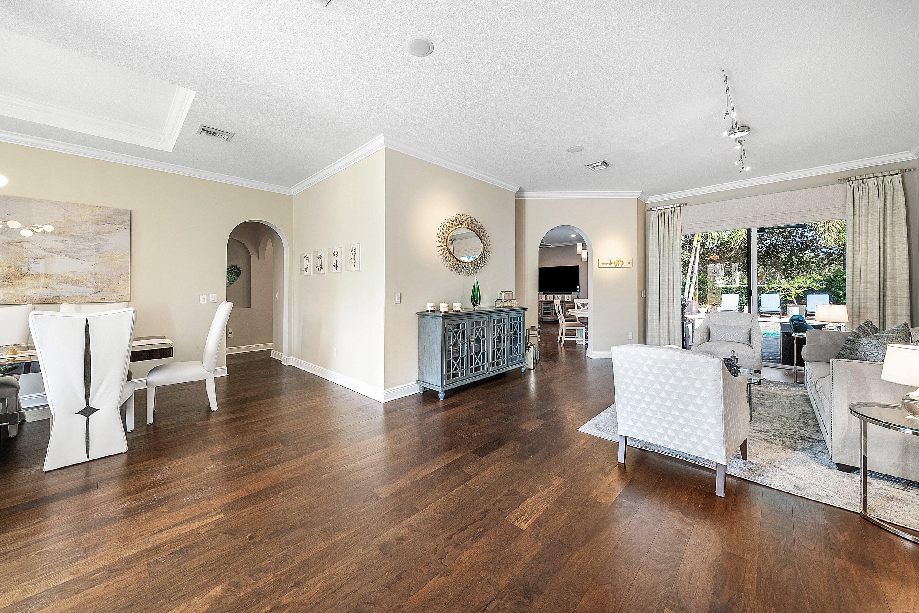 287 Rudder Cay Way Jupiter, FL 33458 - Photo 37 of 88 a living room with fireplace furniture and a wooden floor