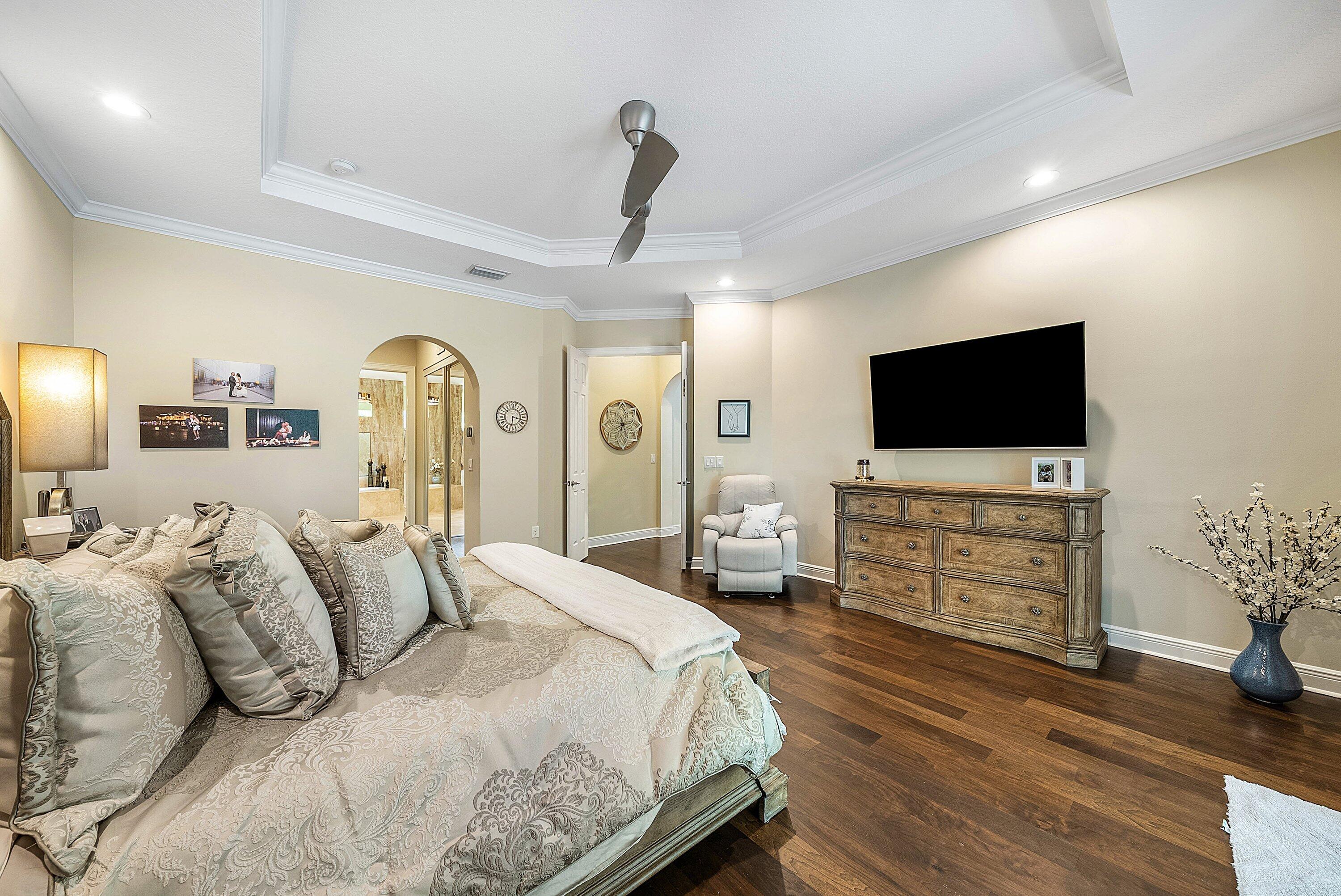 287 Rudder Cay Way Jupiter, FL 33458 - Photo 39 of 88 a bedroom with a bed and a flat screen tv