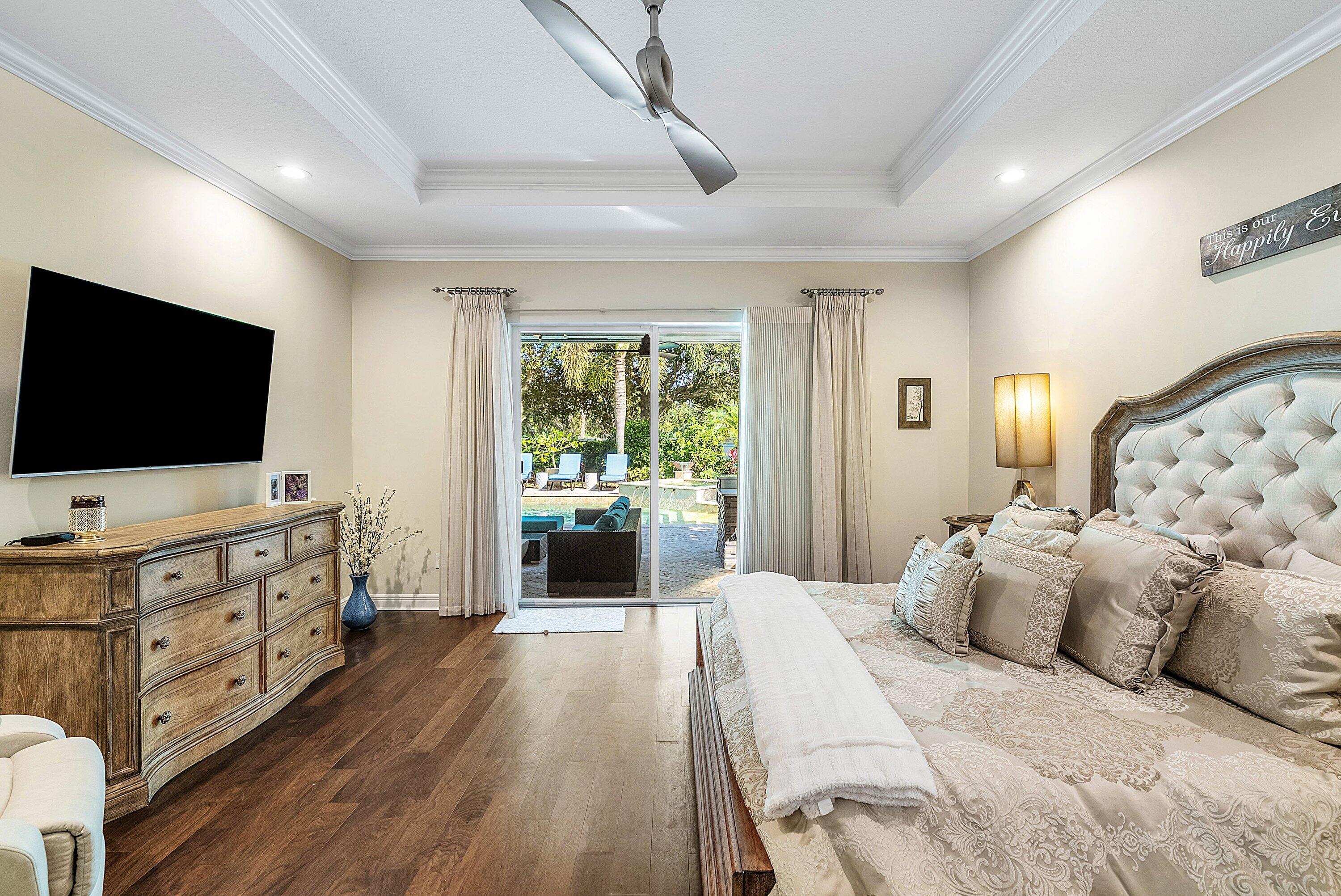 287 Rudder Cay Way Jupiter, FL 33458 - Photo 40 of 88 a bedroom with furniture and flat screen tv