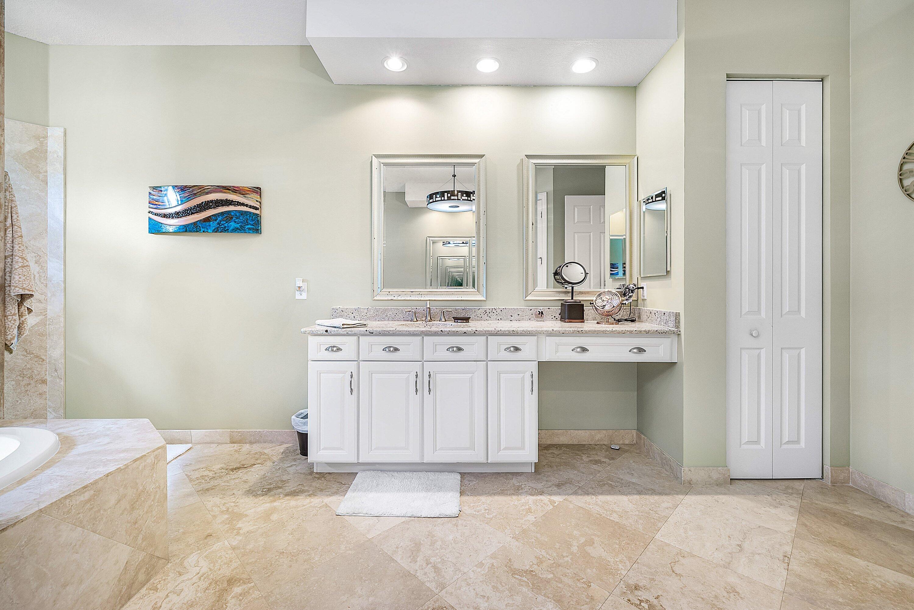 287 Rudder Cay Way Jupiter, FL 33458 - Photo 44 of 88 a bathroom with a sink vanity and mirror