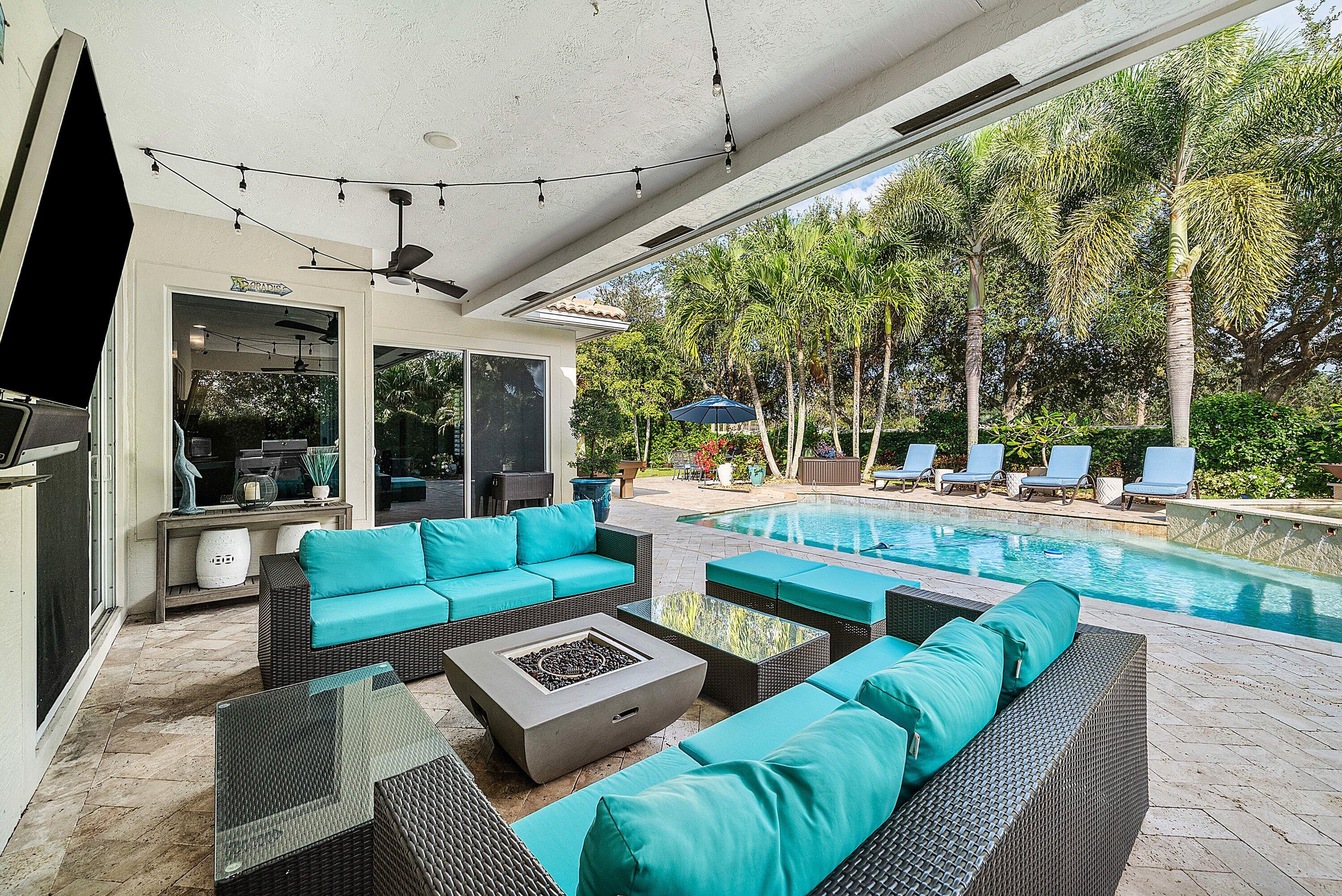 287 Rudder Cay Way Jupiter, FL 33458 - Photo 46 of 88 a outdoor living space with patio furniture and a fireplace