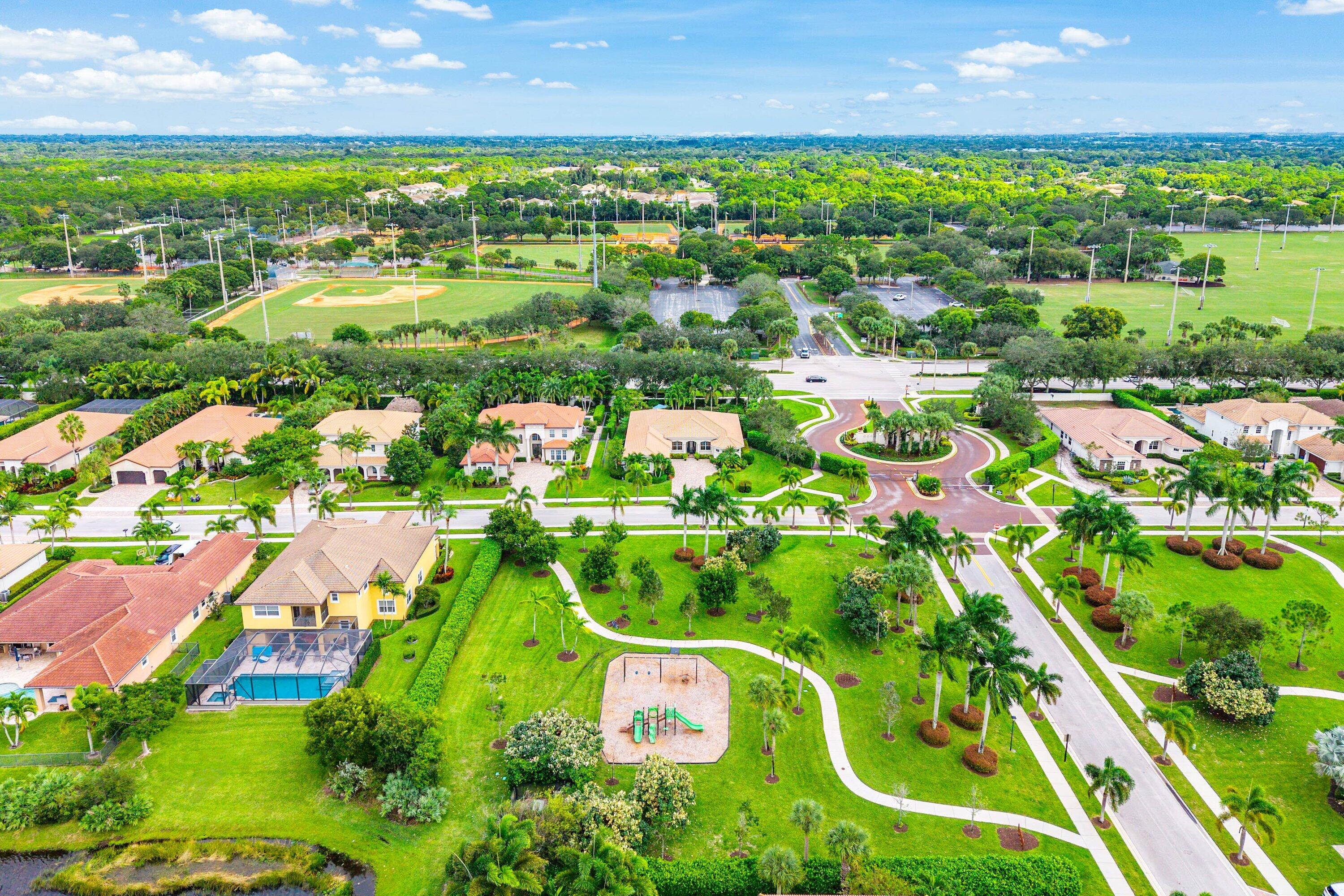 287 Rudder Cay Way Jupiter, FL 33458 - Photo 86 of 88 an aerial view of residential houses with outdoor space and street view
