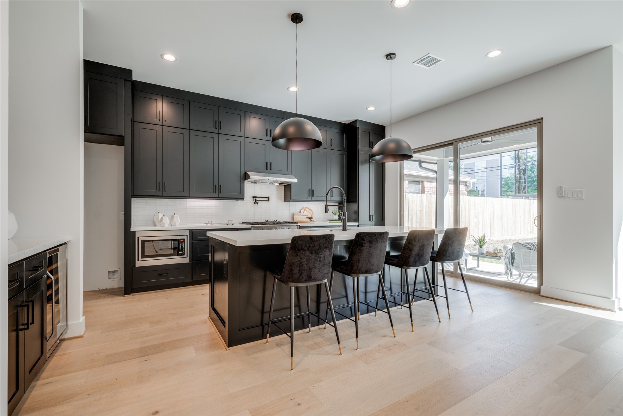 1306 Crocker Street Houston, TX 77019 - Photo 23 of 48 a large kitchen with a table and chairs