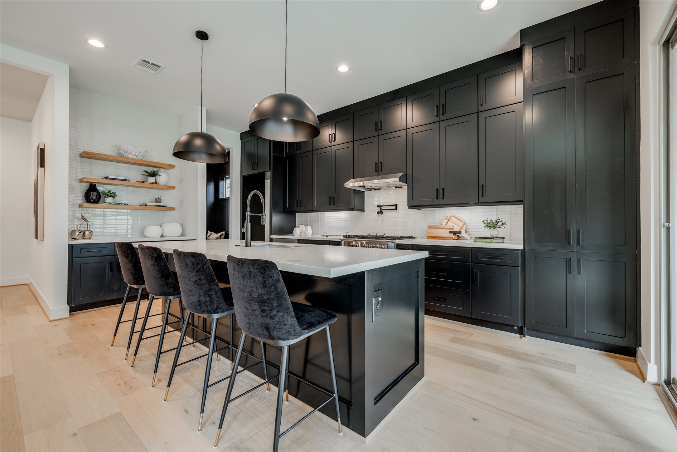 1306 Crocker Street Houston, TX 77019 - Photo 26 of 48 a kitchen with a table and chairs in it