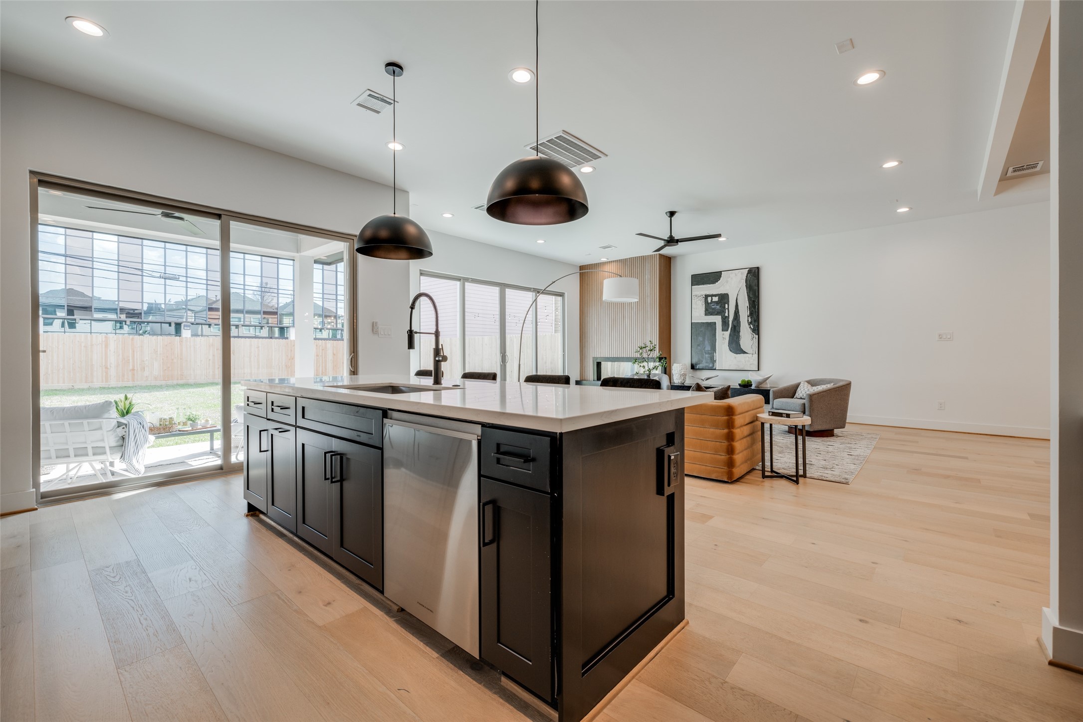 1306 Crocker Street Houston, TX 77019 - Photo 31 of 48 a kitchen with stainless steel appliances granite countertop a sink a stove and a wooden floors