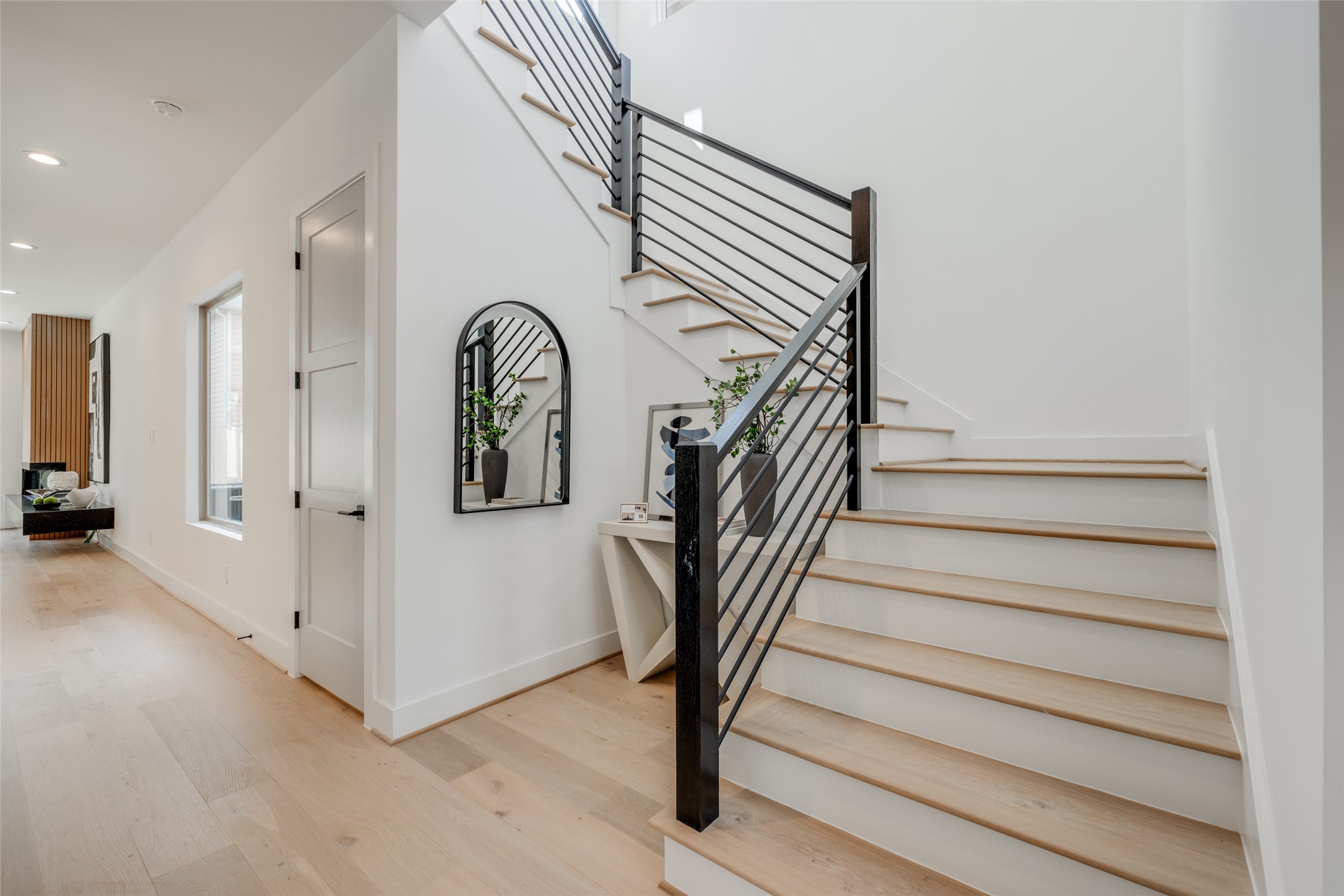 1306 Crocker Street Houston, TX 77019 - Photo 35 of 48 a view of entryway with stairs and wooden floor