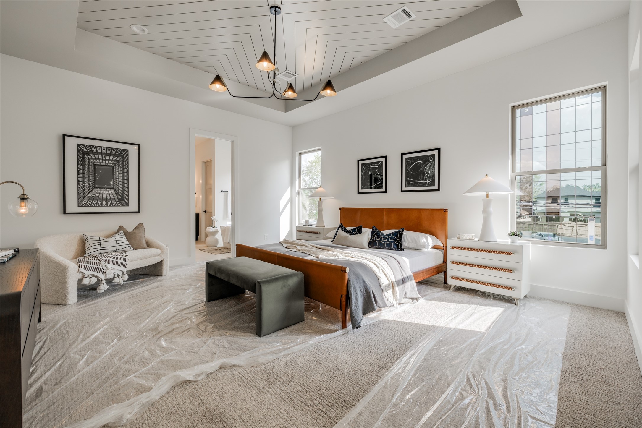 1306 Crocker Street Houston, TX 77019 - Photo 36 of 48 a bedroom with a bed and a chandelier