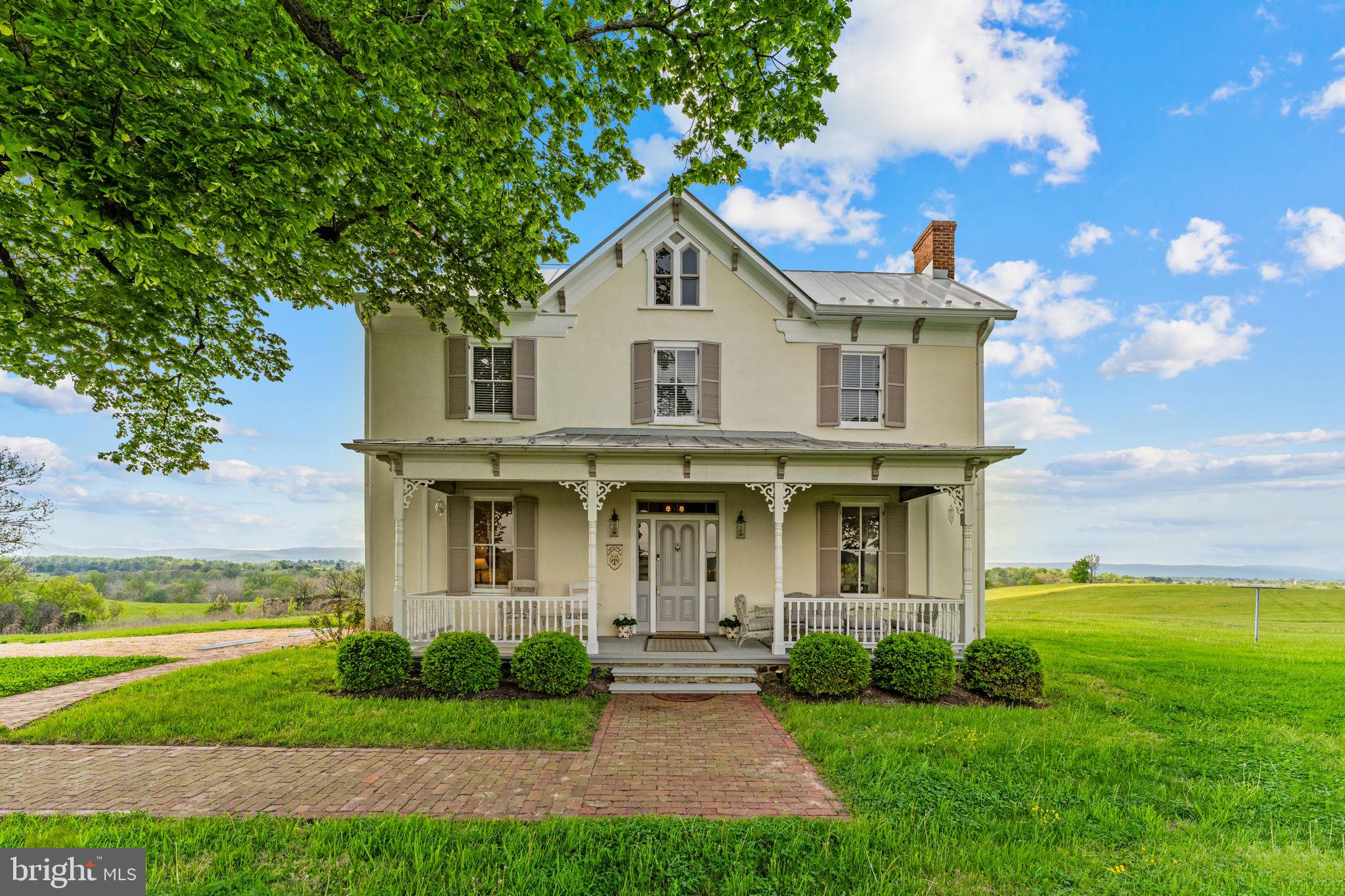 9078 Maidstone Road Delaplane, VA 20144 - Photo 2 of 36 a front view of a house with garden