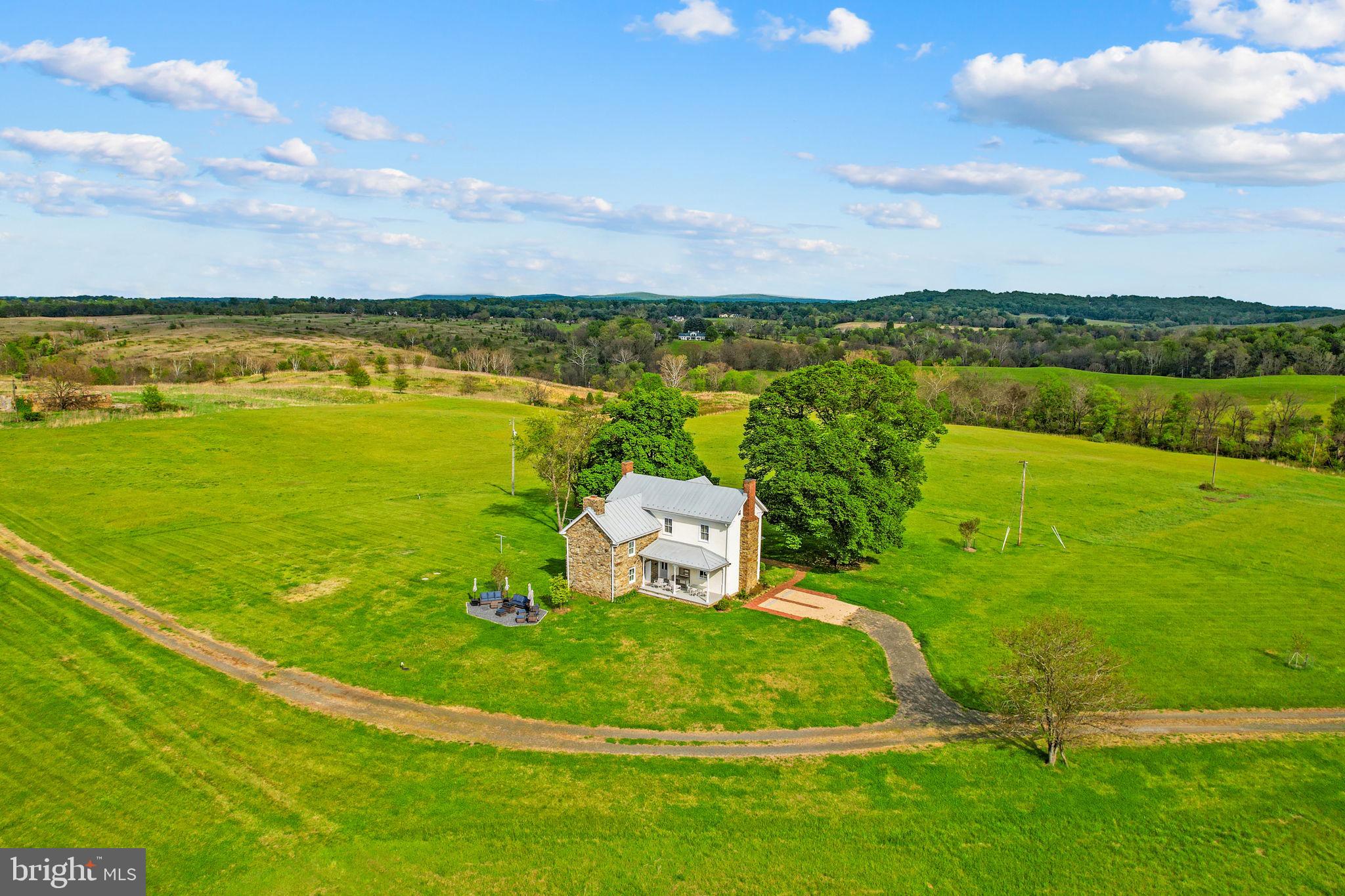 9078 Maidstone Road Delaplane, VA 20144 - Photo 3 of 36 a view of a lake with a big yard