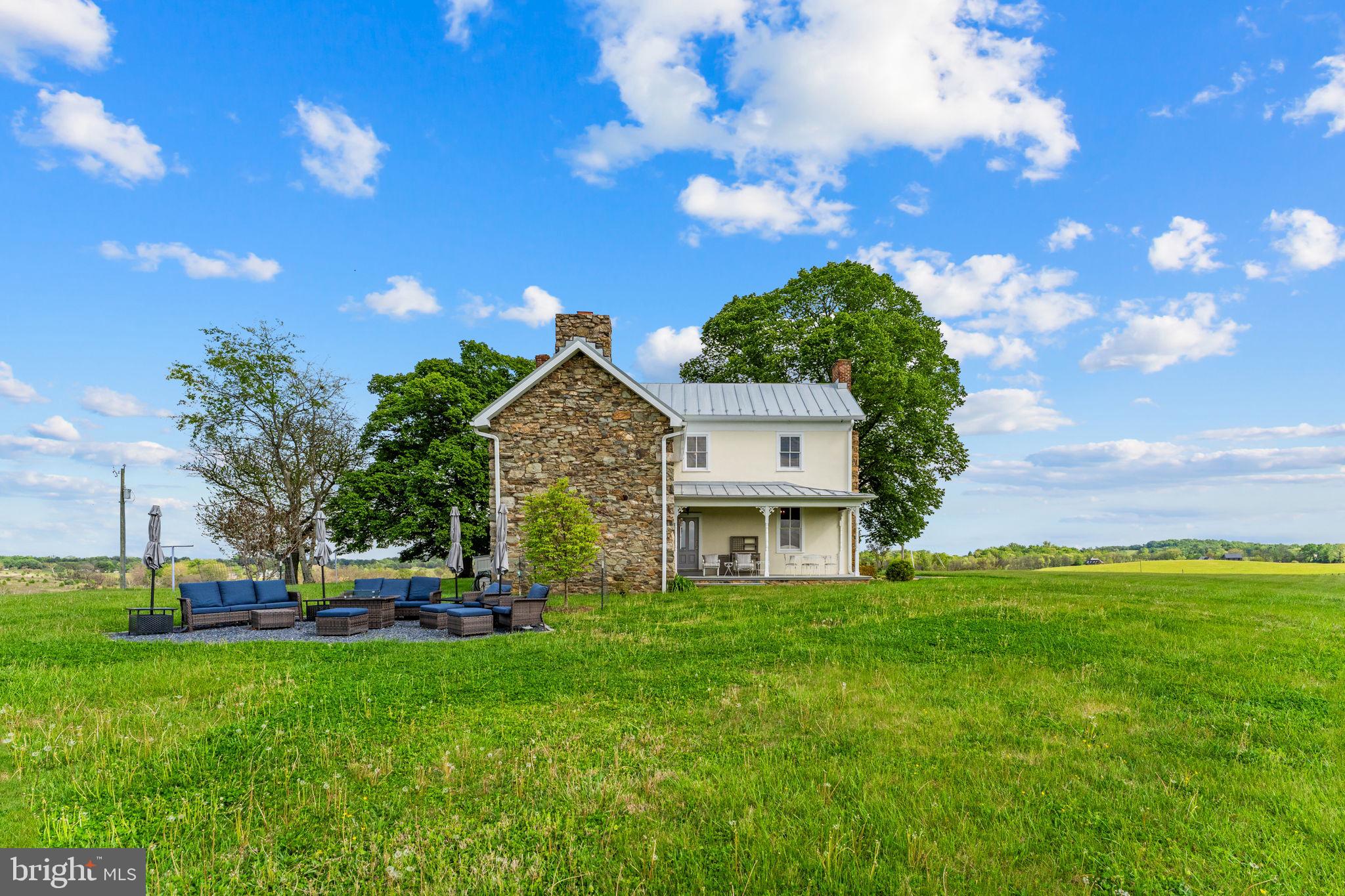 9078 Maidstone Road Delaplane, VA 20144 - Photo 10 of 36 a front view of a house with garden