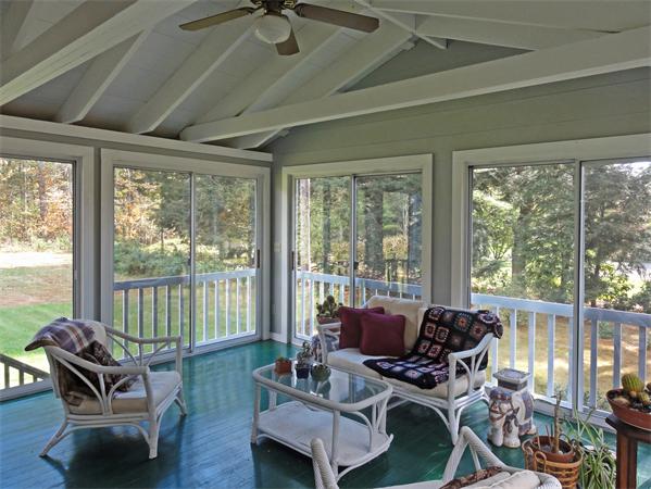 225 Stow Road Harvard, MA 01451 - Photo 11 of 24 a living room with furniture and a floor to ceiling window