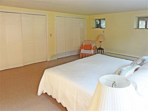 225 Stow Road Harvard, MA 01451 - Photo 16 of 24 a bedroom with a bed and a cabinets