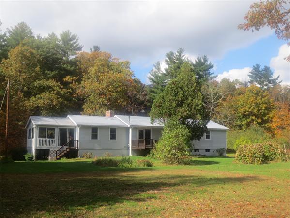 225 Stow Road Harvard, MA 01451 - Photo 2 of 24 a front view of a house with a garden