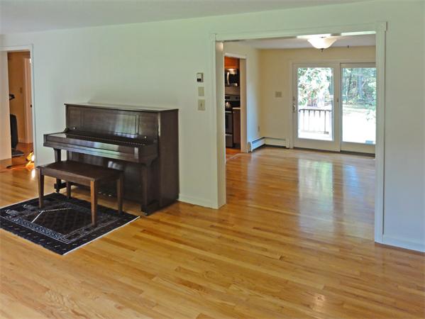 225 Stow Road Harvard, MA 01451 - Photo 5 of 24 a kitchen with granite countertop a stove and a wooden floor