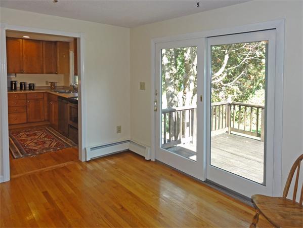 225 Stow Road Harvard, MA 01451 - Photo 7 of 24 a view of an empty room with wooden floor and a window