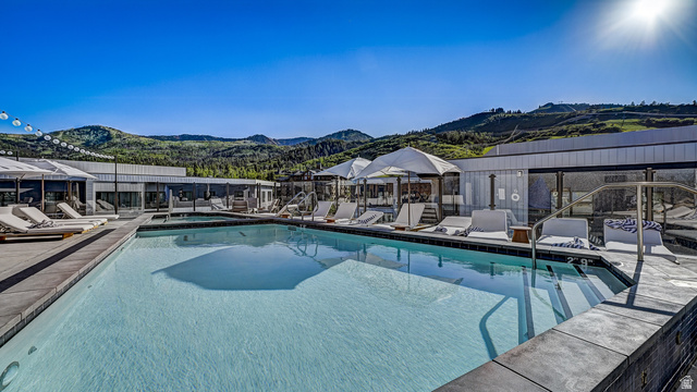 2417 West High Road, Unit 2515 Park City, UT 84098 - Photo 36 of 67 Community pool with a mountain view and a patio