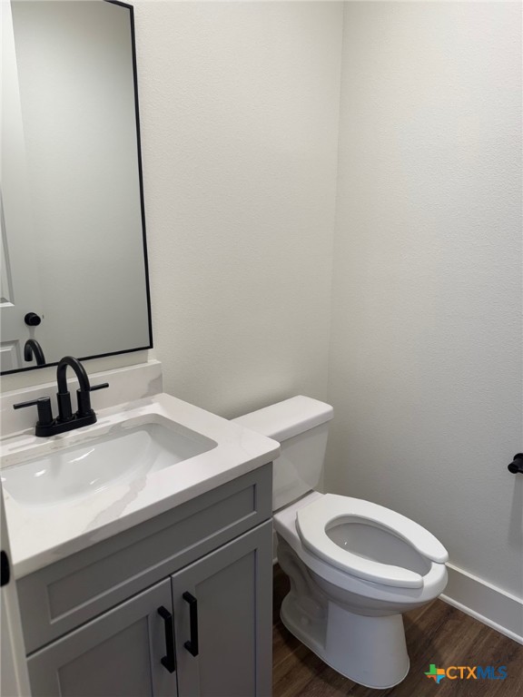 11 South Main Street, Unit 106 Temple, TX 76501 - Photo 12 of 13 a bathroom with a sink a toilet and mirror