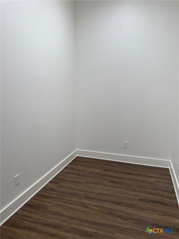 11 South Main Street, Unit 106 Temple, TX 76501 - Photo 13 of 13 a view of an empty room with wooden floor